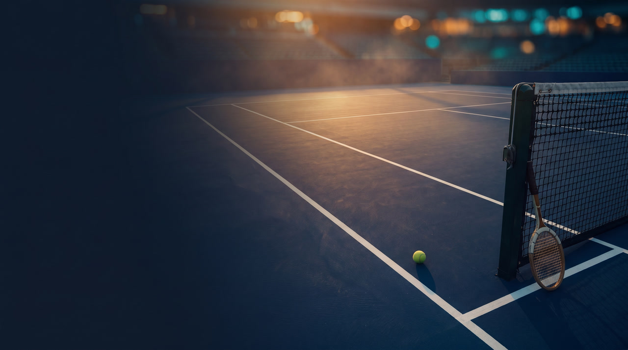 Empty hard court at twilight in a grand stadium